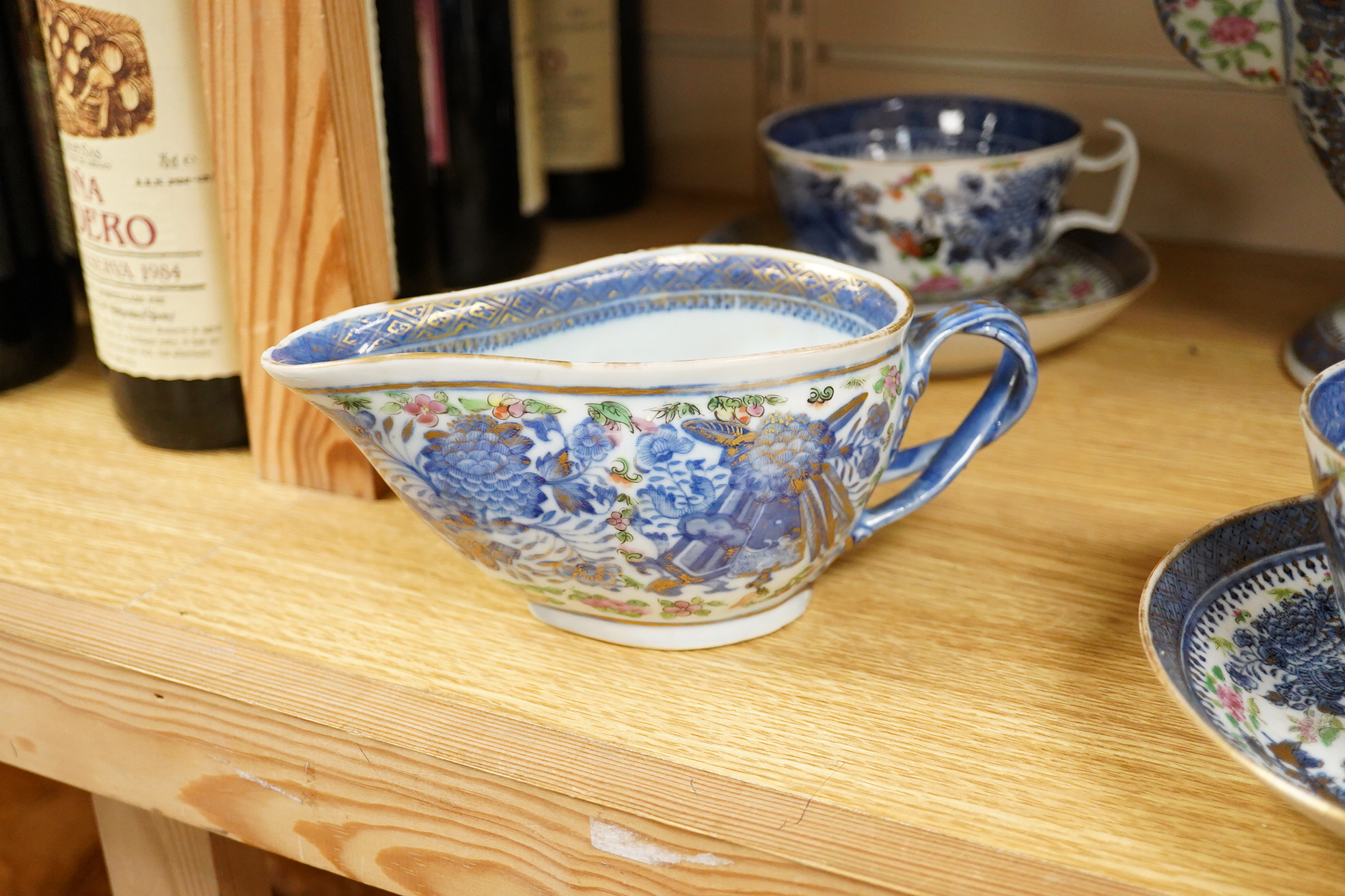 An early 19th century Chinese porcelain part tea set and matching sauce boat - teapot 25cm high